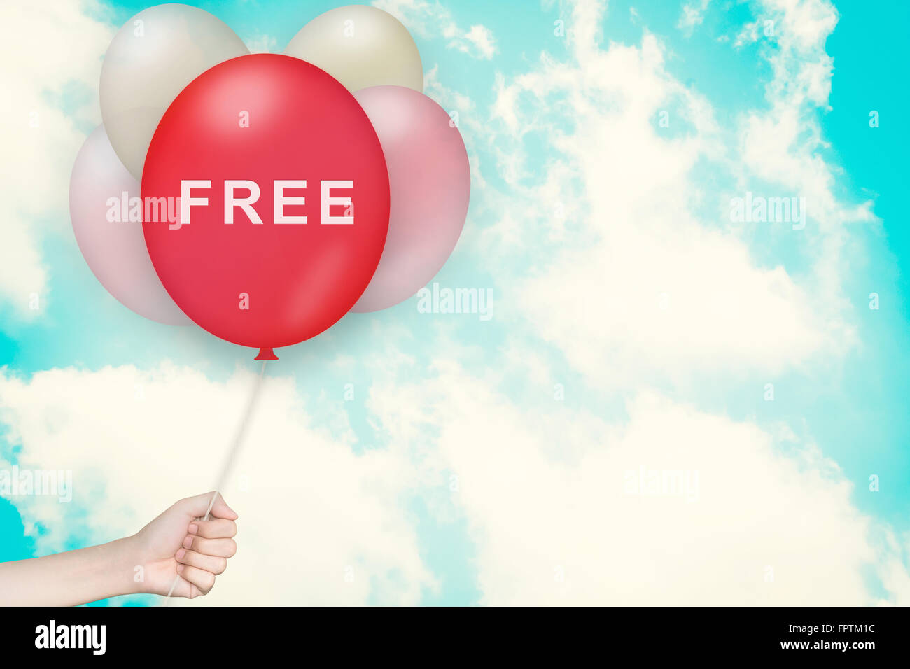 Hand Holding free Balloon with sky and vintage style Stock Photo