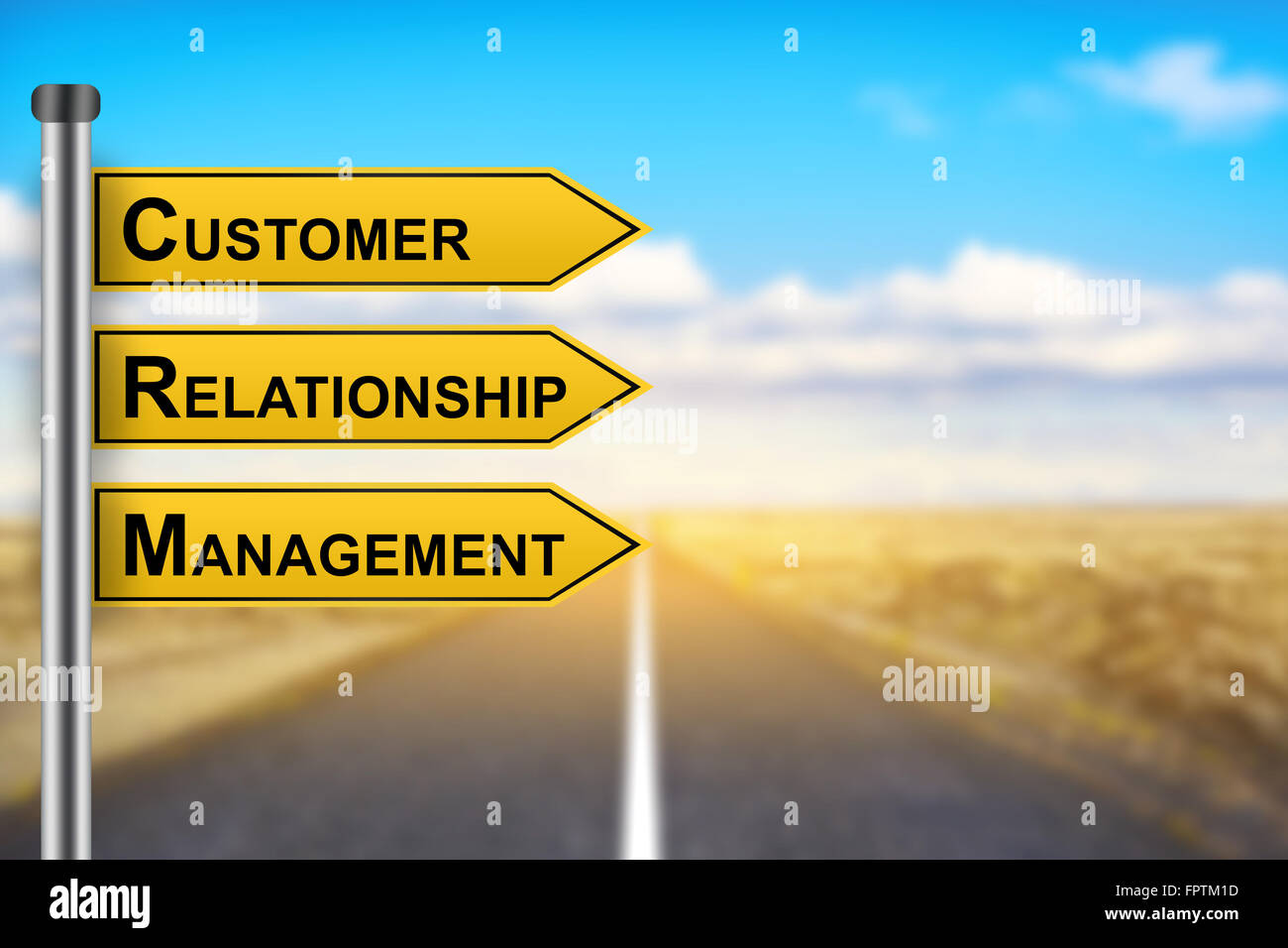 CRM or Customer relationship management words on yellow road sign with blurred background Stock Photo