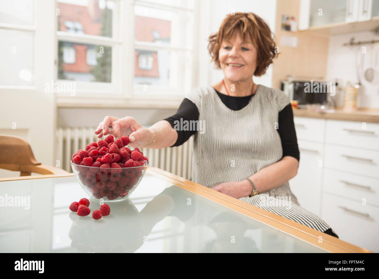 Senior Woman Picking Berries High Resolution Stock Photography and ...