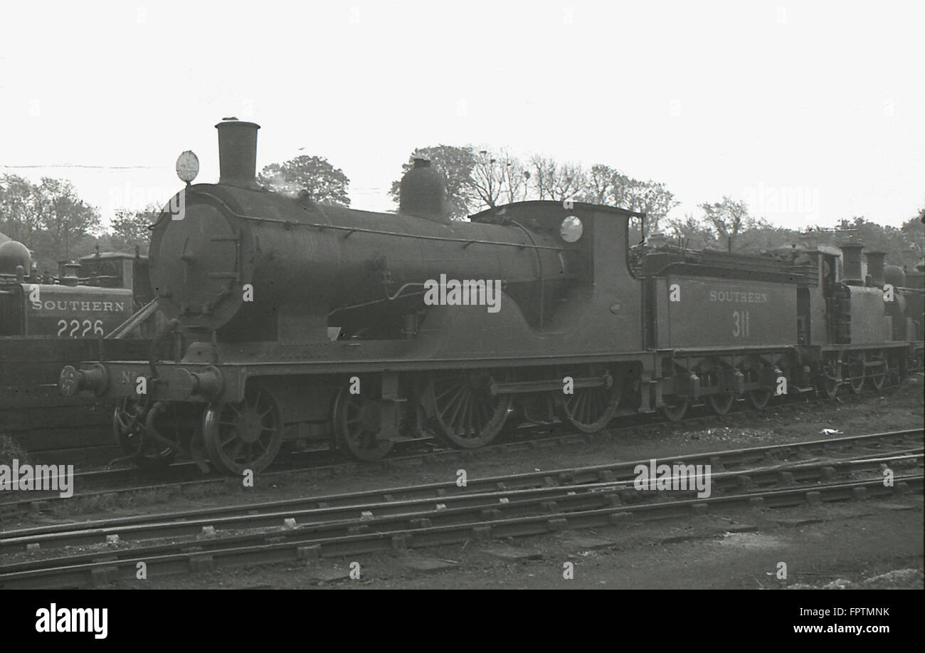LSWR T9 4-4-0 Locomotive as Southern Railway No.311 with D1 2226 behind Stock Photo