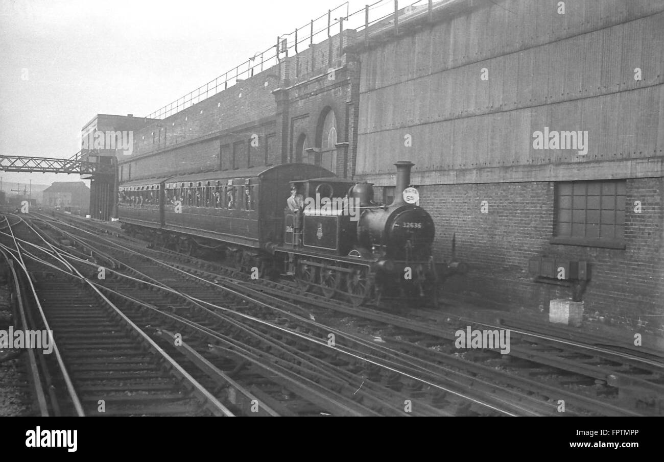 LBSCR A1X Terrier 0-6-0T hauls an RCTS Excursion past Brighton shed with an RCTS excursion to Brighton (Kemp Town) on 5th October 1952 Stock Photo