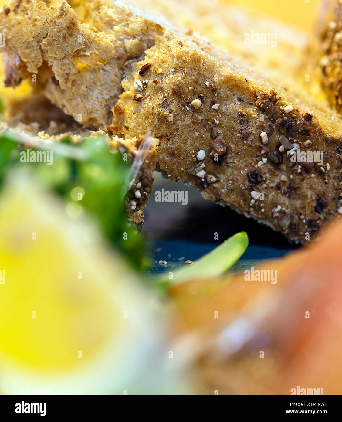 Close up selective focus image of multigrain bread in a salad Stock Photo