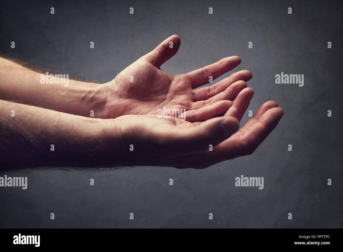Hands reaching out concept for help, religion, salvation, forgiveness, assistance and love or begging Stock Photo