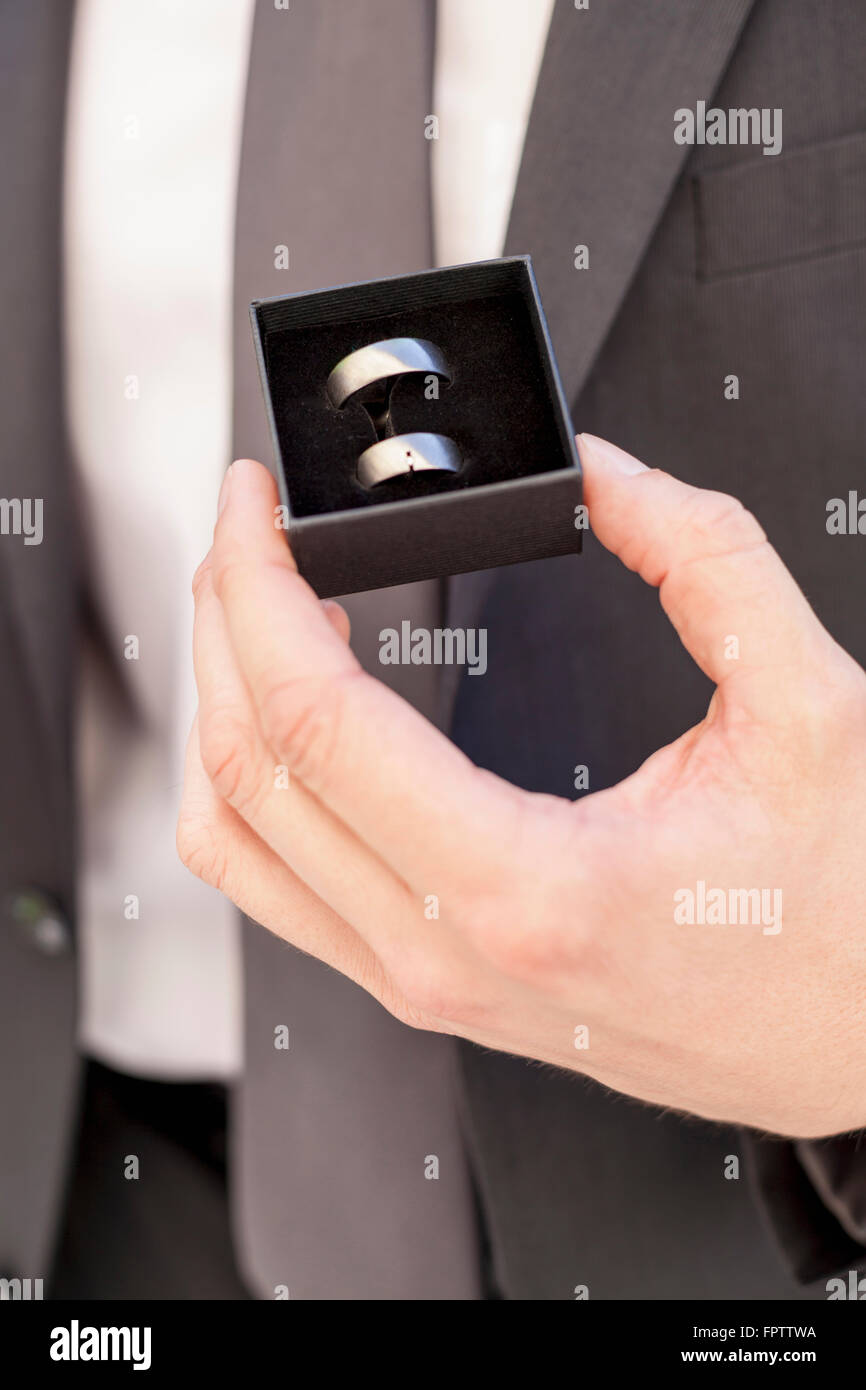 Groom holding his wedding ring, Munich, Bavaria, Germany Stock Photo
