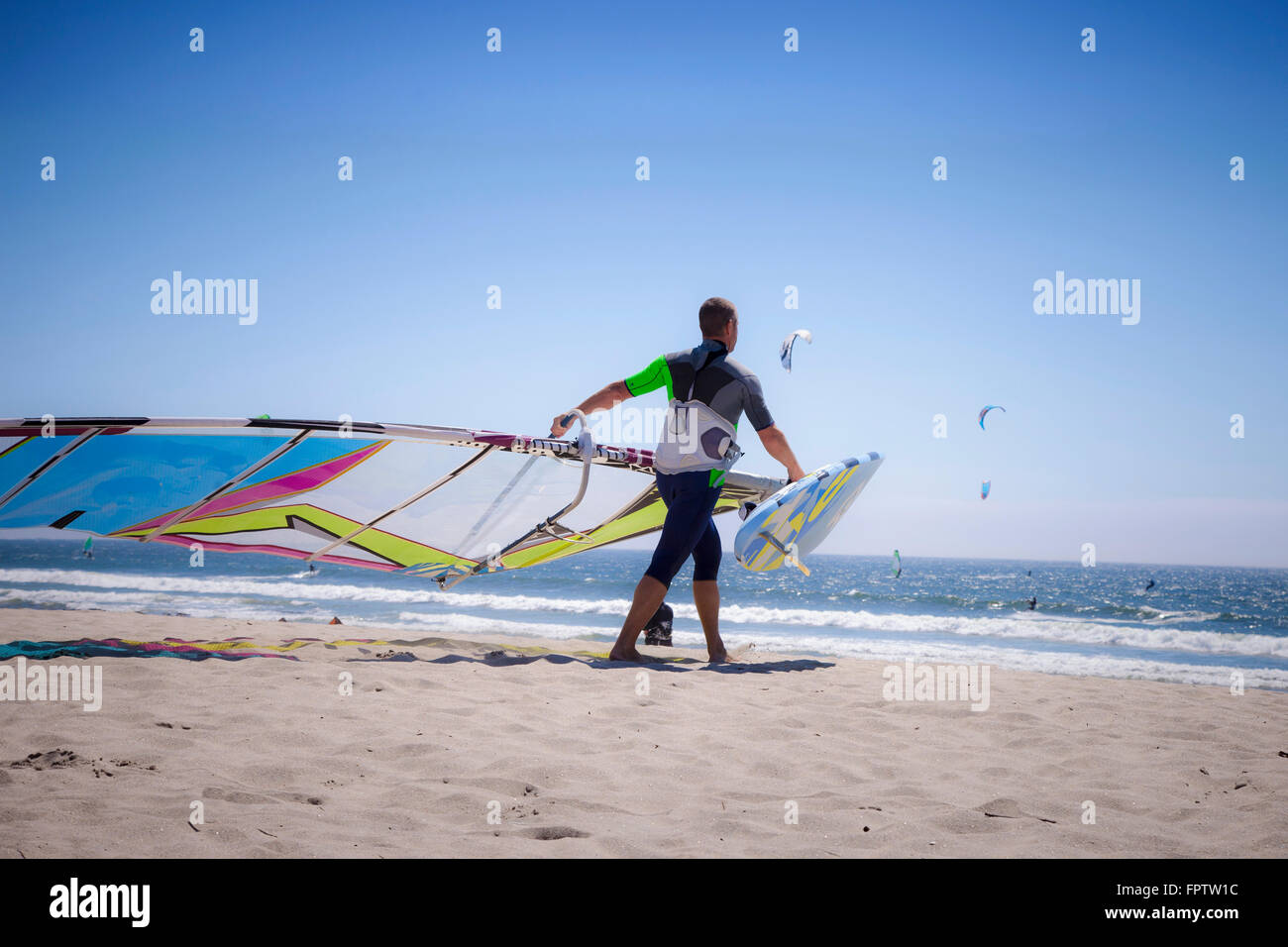 Mature man windsurfing in the sea, Viana do Castelo, Norte Region, Portugal Stock Photo