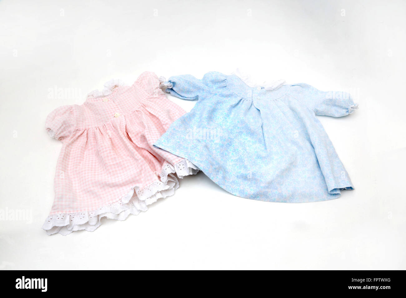 Two Baby Girl Dresses Pink And Blue Seventies Stock Photo