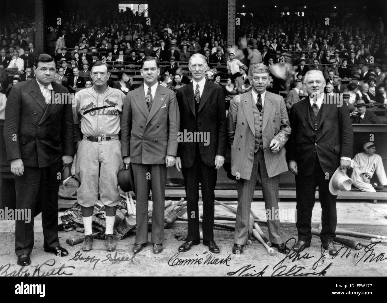 1930s BASEBALL LUMINARIES BABE RUTH, GABBY STREET, CONNIE MACK, NICK ALTROCK, JOHN MCGRAW AT BASEBALL STADIUM LOOKING AT CAMERA Stock Photo