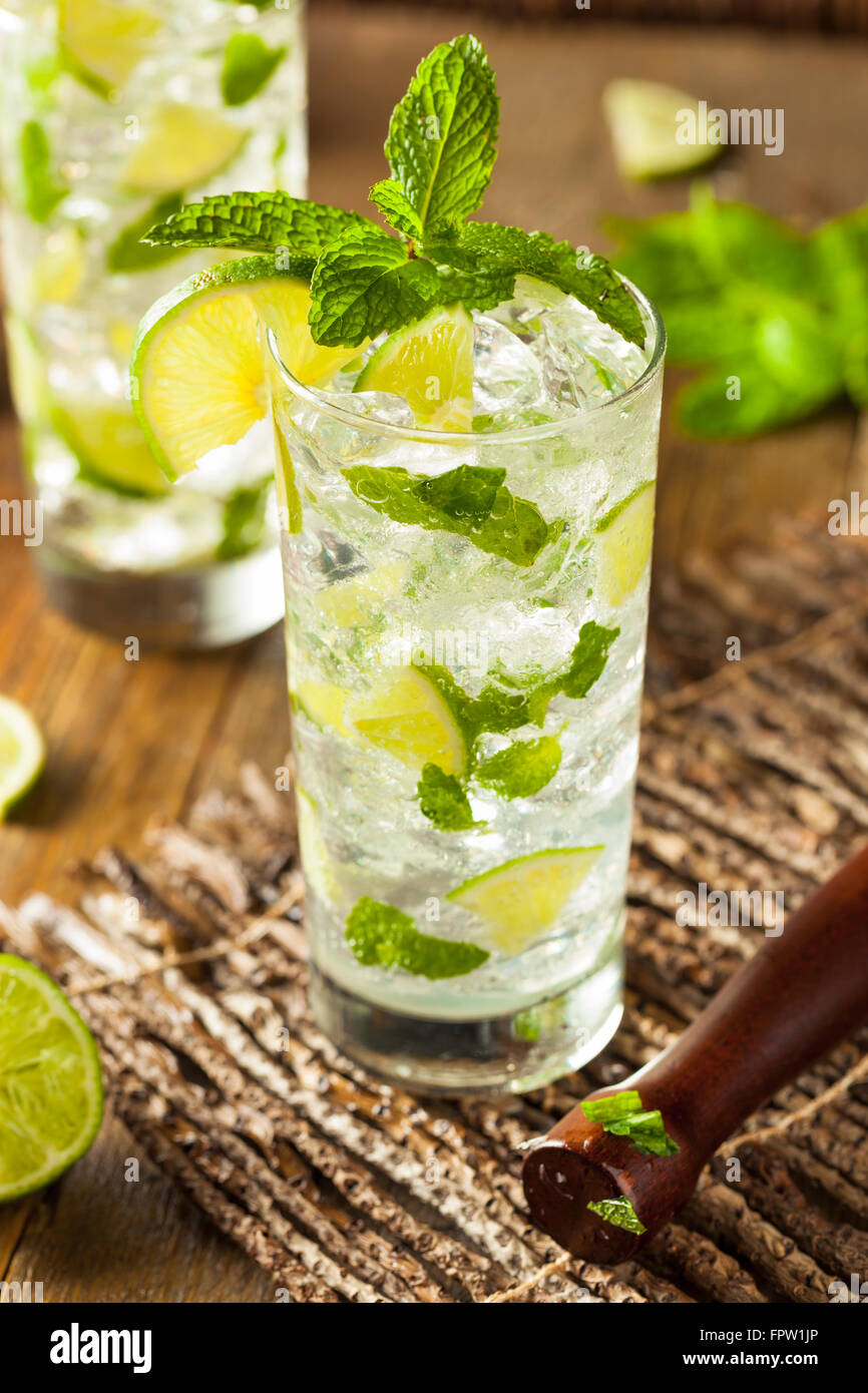 Homemade Alcoholic Mojito with LIme and Green Mint Stock Photo
