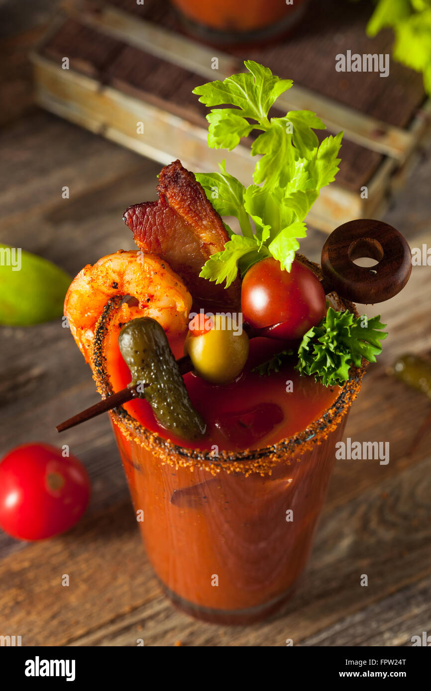 Homemade Bacon Spicy Vodka Bloody Mary with Tomatos, Olive and Celery