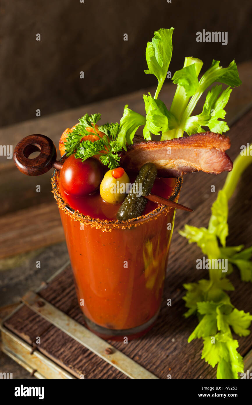 Homemade Bacon Spicy Vodka Bloody Mary with Tomatos, Olive and Celery