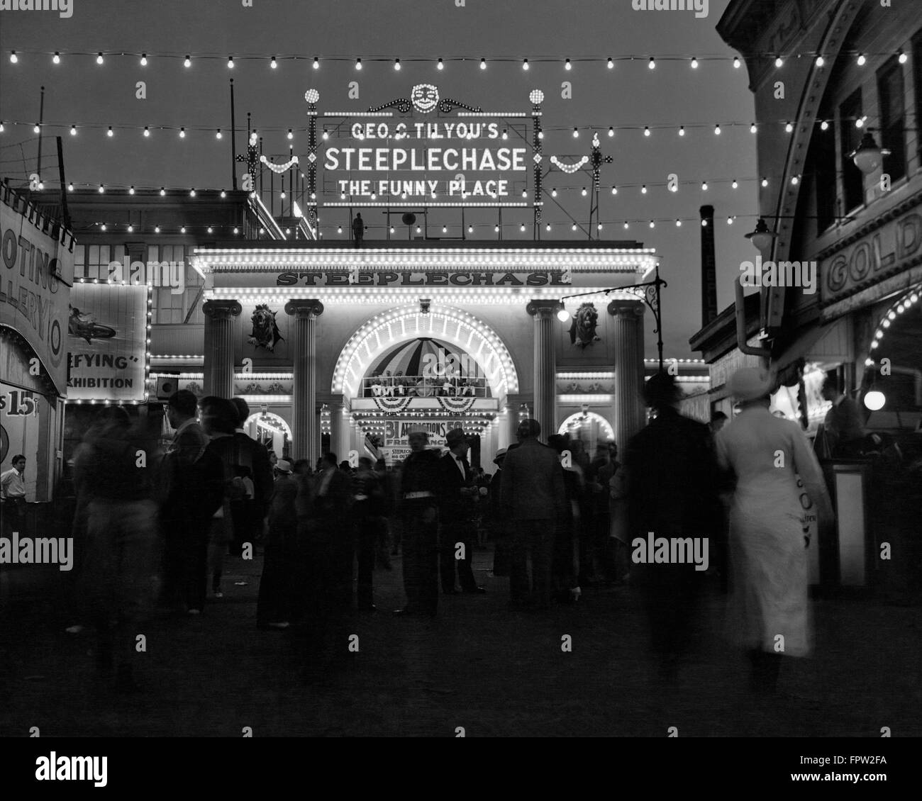 1930s 1940s NIGHT LIGHTS AMUSEMENT PARK BROOKLYN NY ENTRANCE STEEPLECHASE PARK FUNNY PLACE CONEY ISLAND NEW YORK USA Stock Photo