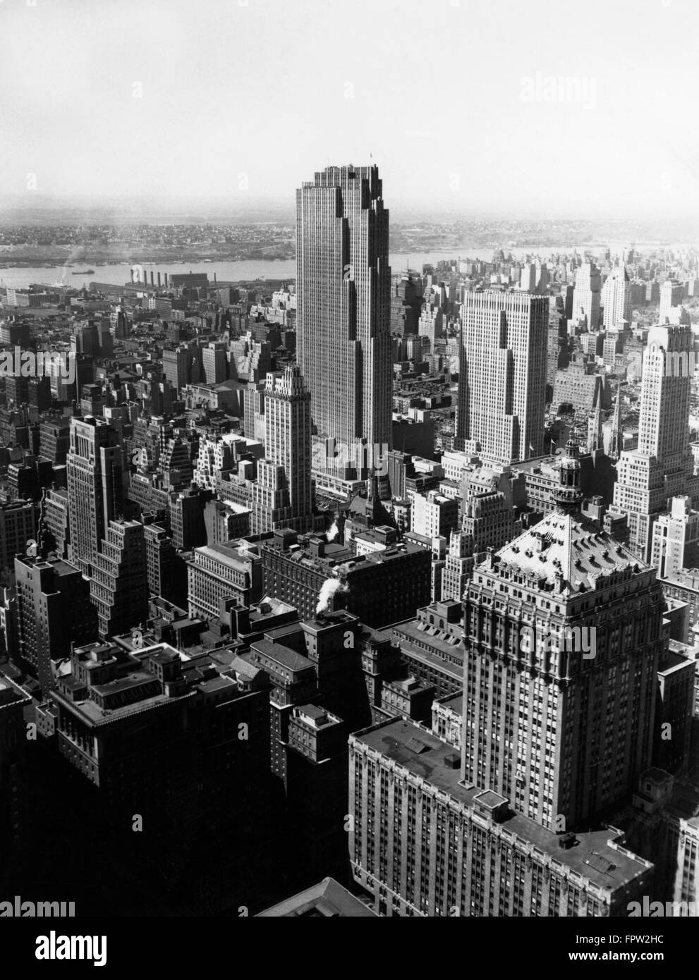 1950s AERIAL VIEW NEW YORK CITY MIDTOWN ROCKEFELLER CENTER RADIO CITY IN MIDDLE GRAND CENTRAL STATION IN FOREGROUND Stock Photo