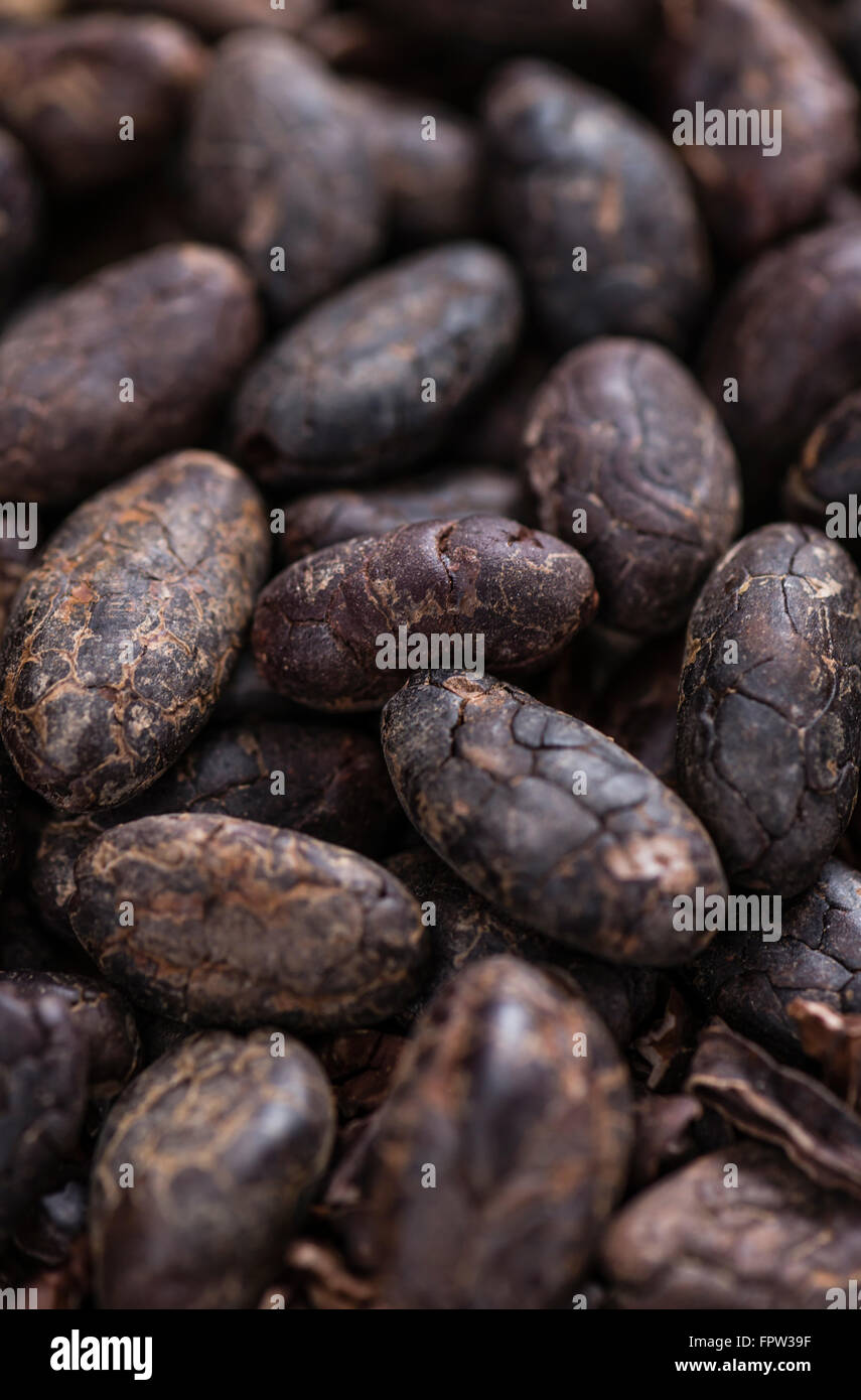 Roasted Cacao Beans (selective focus) on an old wooden table Stock Photo