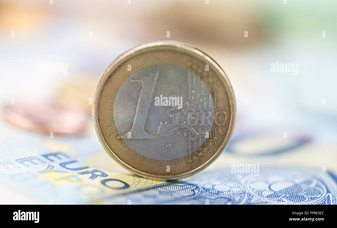 Euro coin on banknotes (detailed macro shot; selective focus) Stock Photo