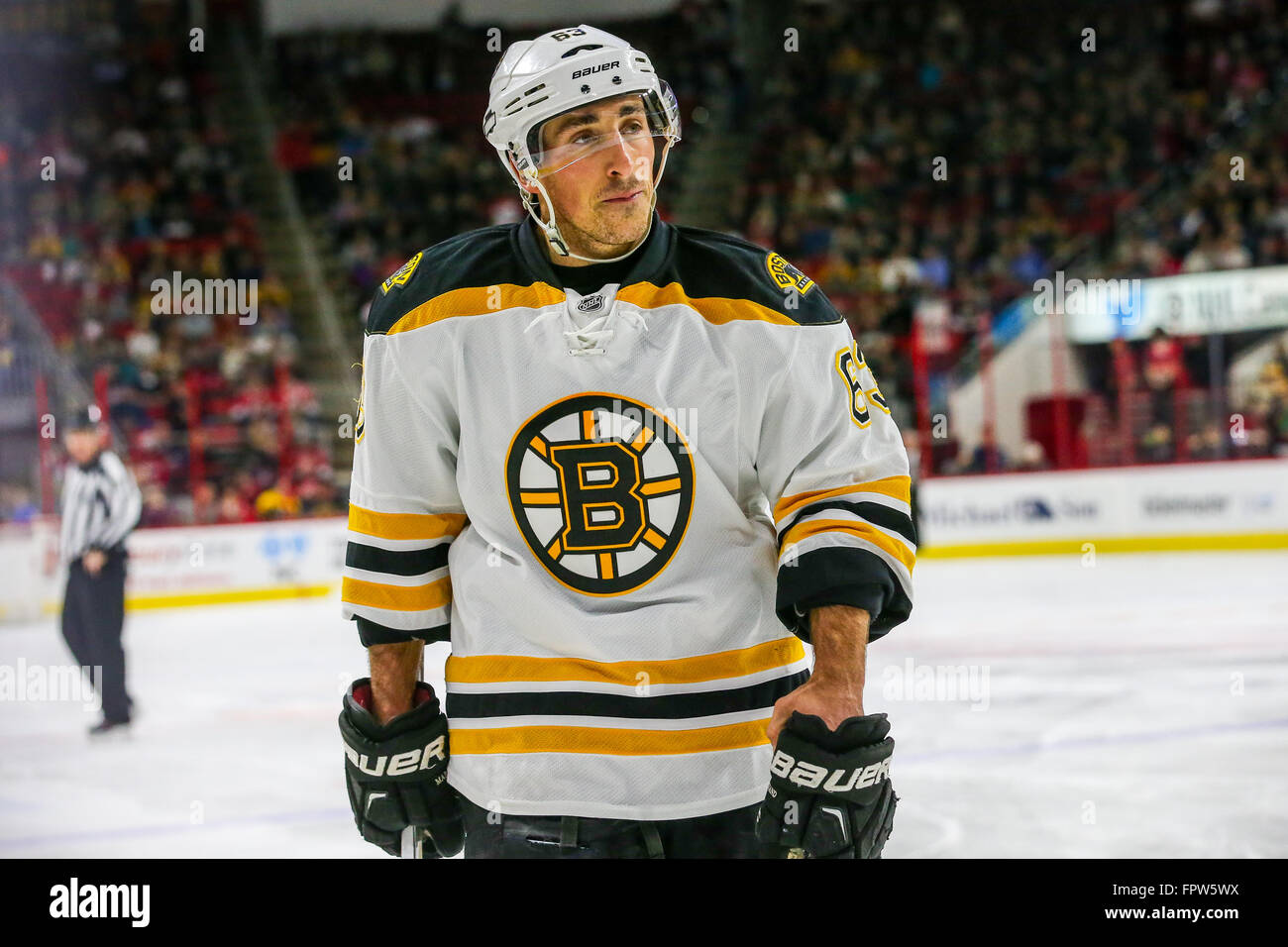 Boston Bruins left wing Brad Marchand (63) wears a green jersey as part of  the team's Salute to Service to honor members of the military while warming  up prior to an NHL