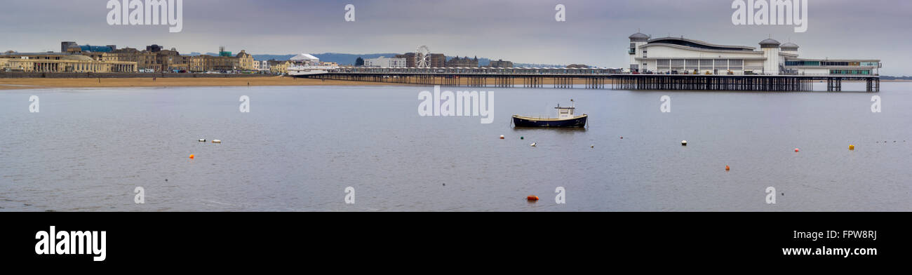 Grand Pier and beach at high tide, Weston-super-mare. A scene looking towards the town across a still sea, in Somerset, UK, Stock Photo