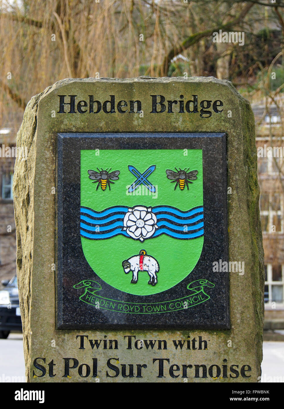 Sign at Hebden Bridge, Yorkshire, showing the town sign and that of St. Pol Sur Turnoise, in France, its twin town. Stock Photo