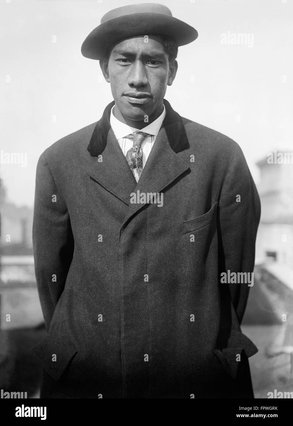 Duke Paoa Kahanamoku, legendary surfer and Olympic swimmer from Honolulu, Hawaii, is included in the Surfing Hall of Fame, Swimming Hall of Fame, and the Olympic Hall of Fame. (Shown here in 1912 on trip to New York for the Olympic trials.) Stock Photo