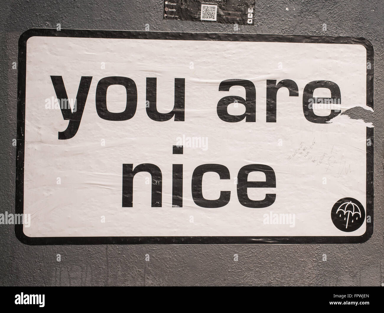 White billboard with the words 'You are nice' on a wall in a street in London. Stock Photo