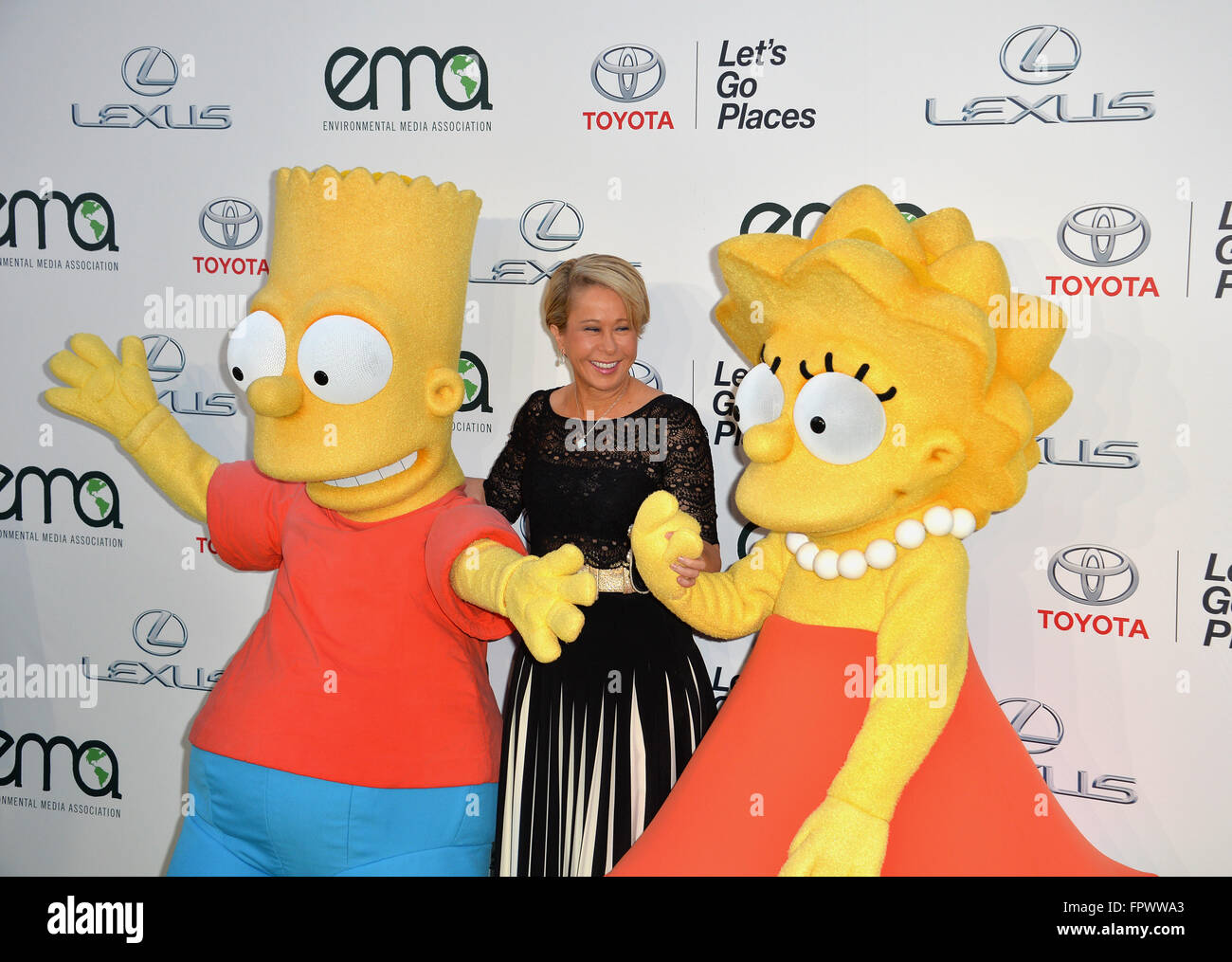 LOS ANGELES, CA - OCTOBER 24, 2015: Simpson's voice actress Yeardley Smith & Bart Simpson & Lisa Simpson characters at the 25th Annual Environmental Media Awards at Warner Bros. Studios, Burbank, CA. Stock Photo