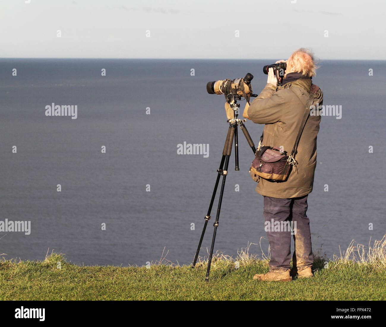 Bird watcher with camera and spotting scope Stock Photo Alamy