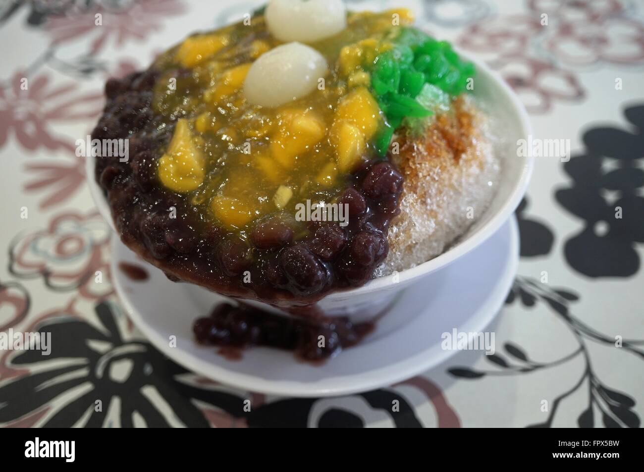 Ais Kacang (ABC), a colorful Malaysian dessert made of shaved ice, beans and colored jelly Stock Photo