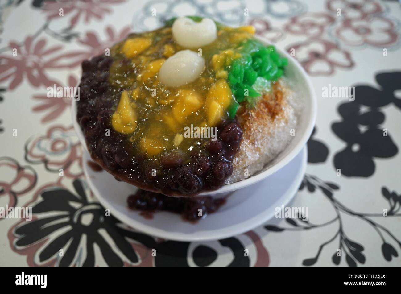 Ais Kacang (ABC), a colorful Malaysian dessert made of shaved ice, beans and colored jelly Stock Photo