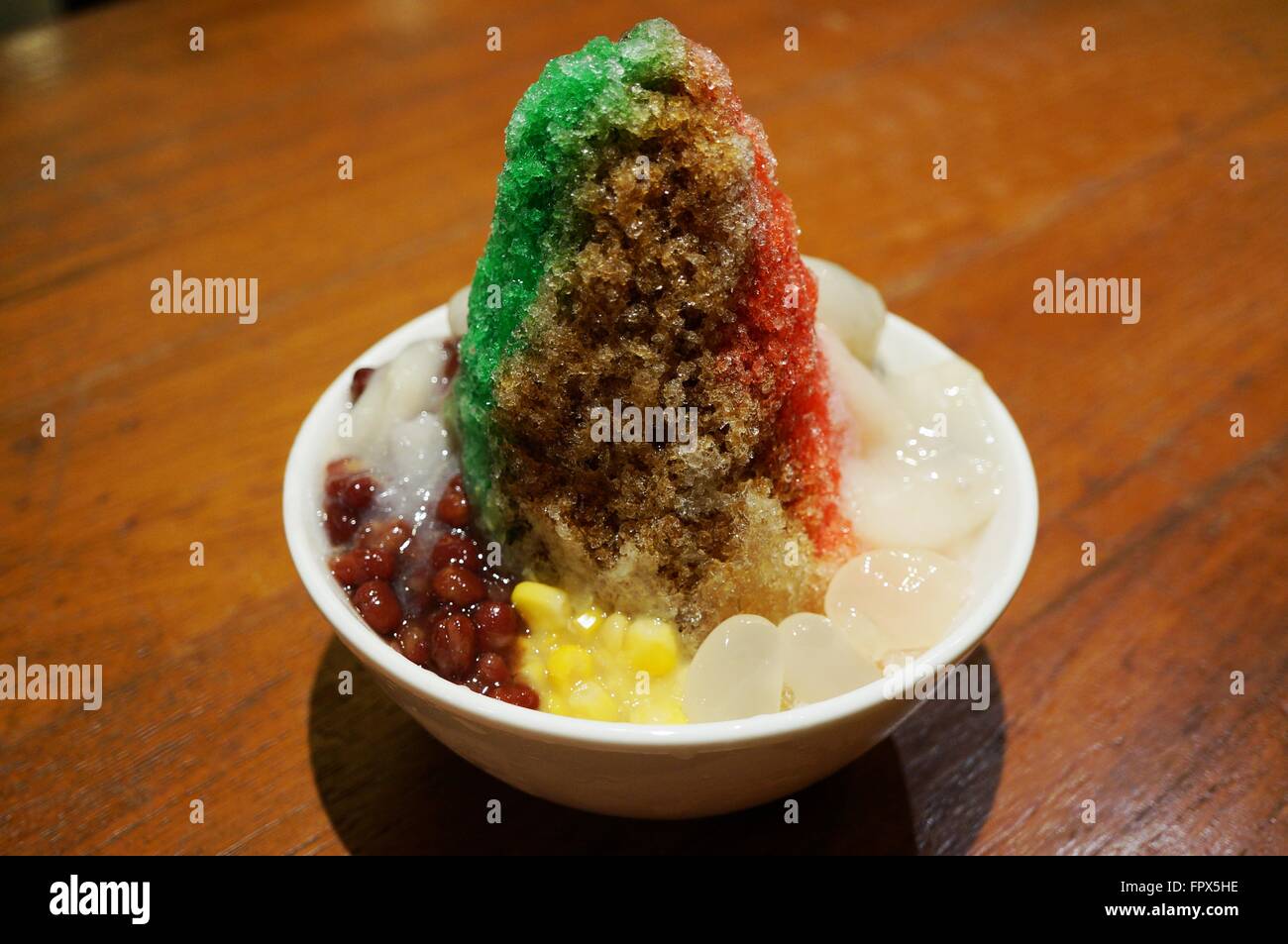 Ais Kacang (ABC), a colorful Malaysian dessert made of shaved ice, beans and colored jelly Stock Photo