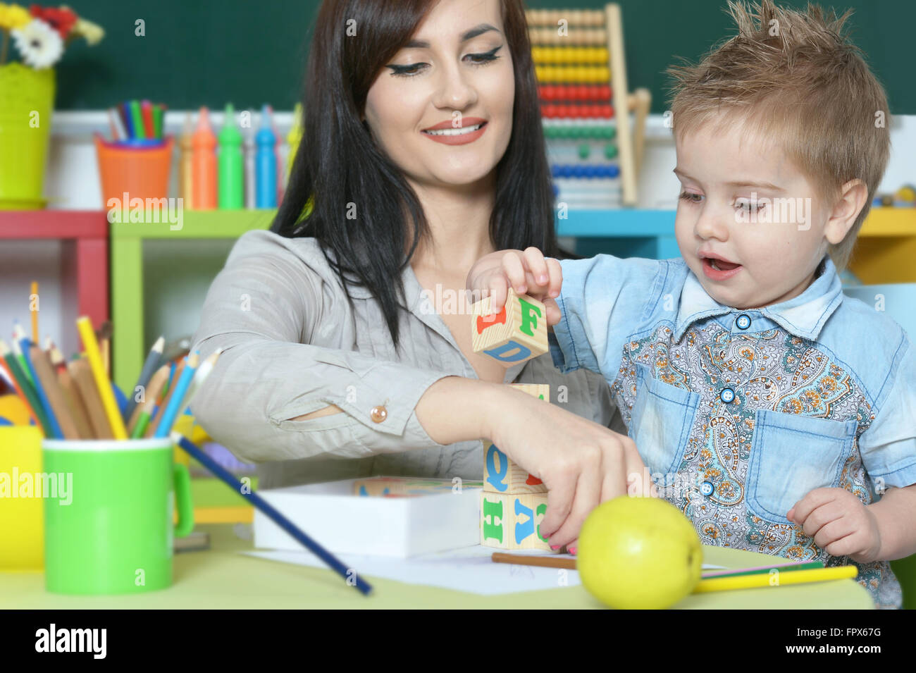 little boy playing with mother Stock Photo - Alamy