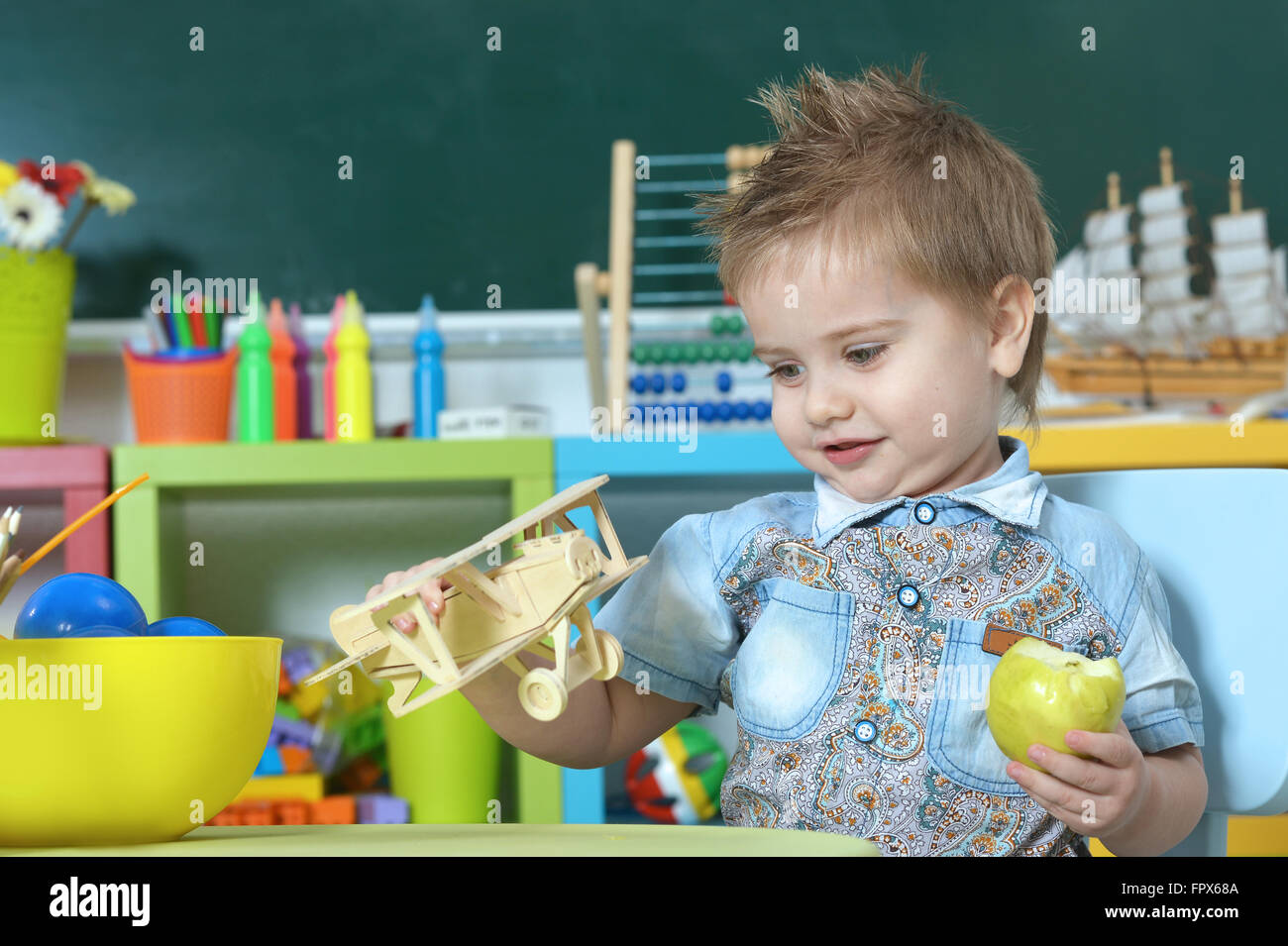 little boy playing with toy Stock Photo - Alamy