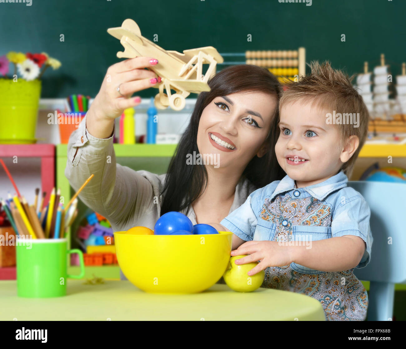 little boy playing with mother Stock Photo - Alamy