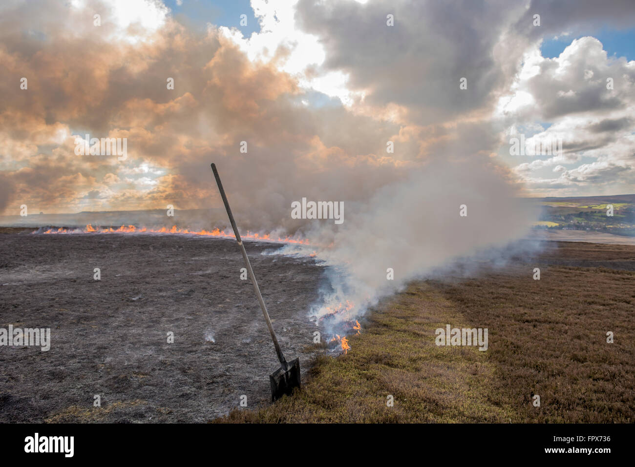 Controlling heather burning on moorland, which is undertaken in game shooting areas. Stock Photo