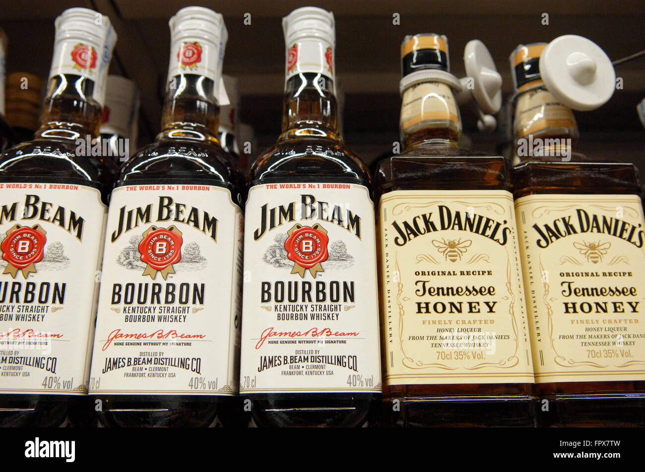 Jim Beam Bourbon and Jack Daniels Tennessee Honey Whiskey on display at a  Carrefour Supermarket in Malaga Spain Stock Photo - Alamy