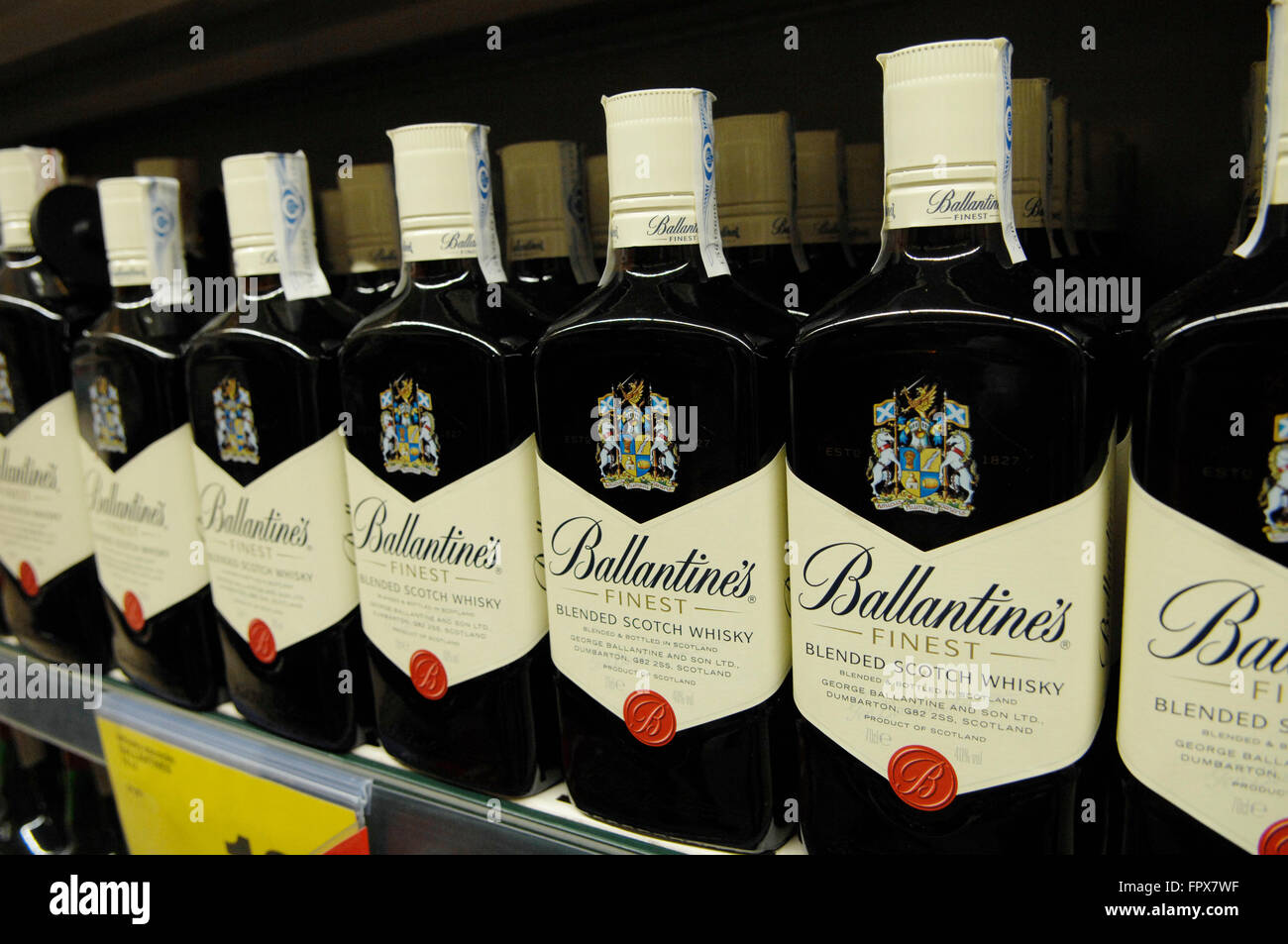 Ballantine's blended Scotch Whisky produced by Pernod Ricard in Dumbarton, Scotland,displayed on a shelve in a supermarket. Stock Photo