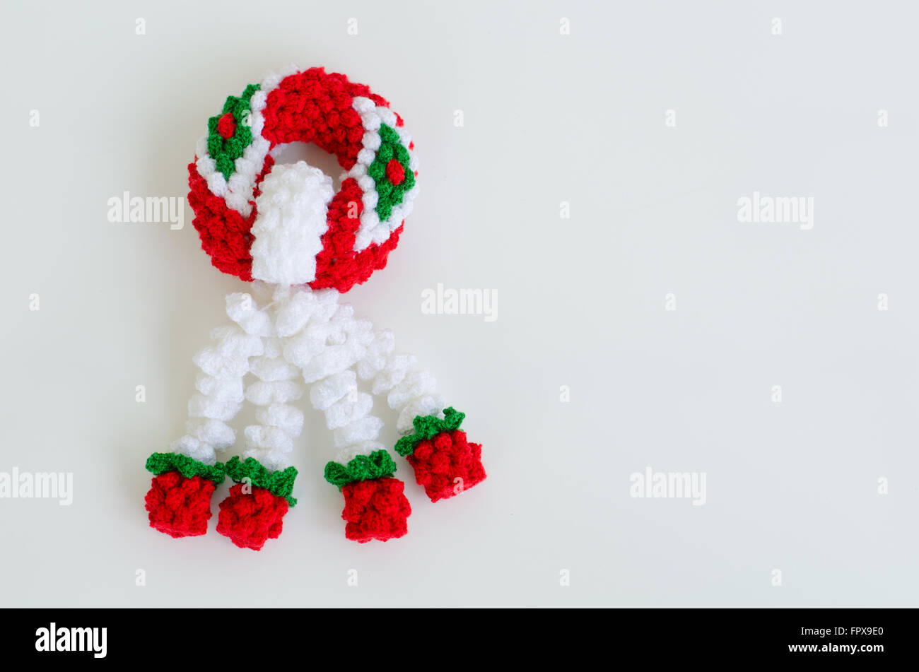 garland knitting on white background Stock Photo