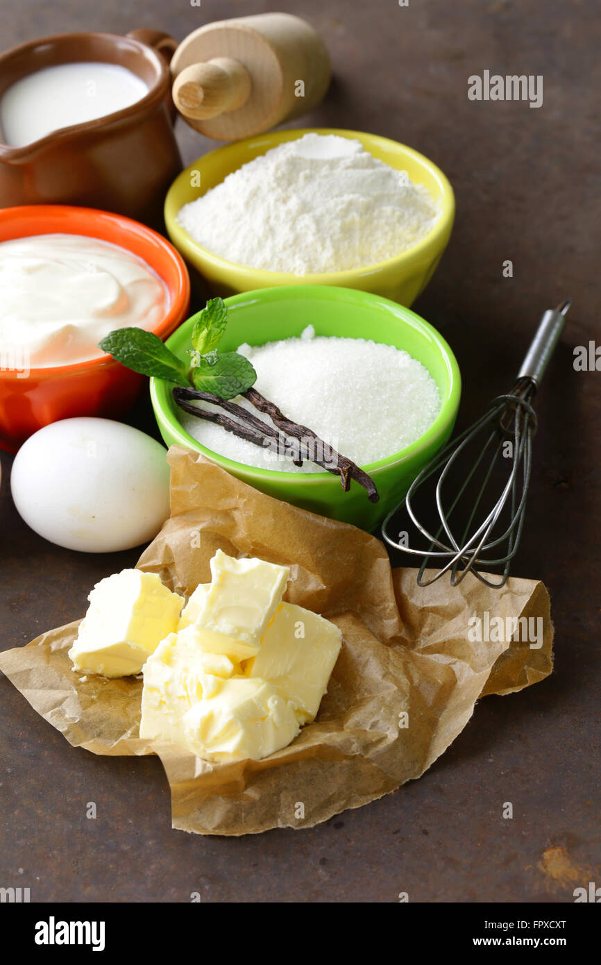 Ingredients for pastry butter, milk, eggs, flour and vanilla sugar on