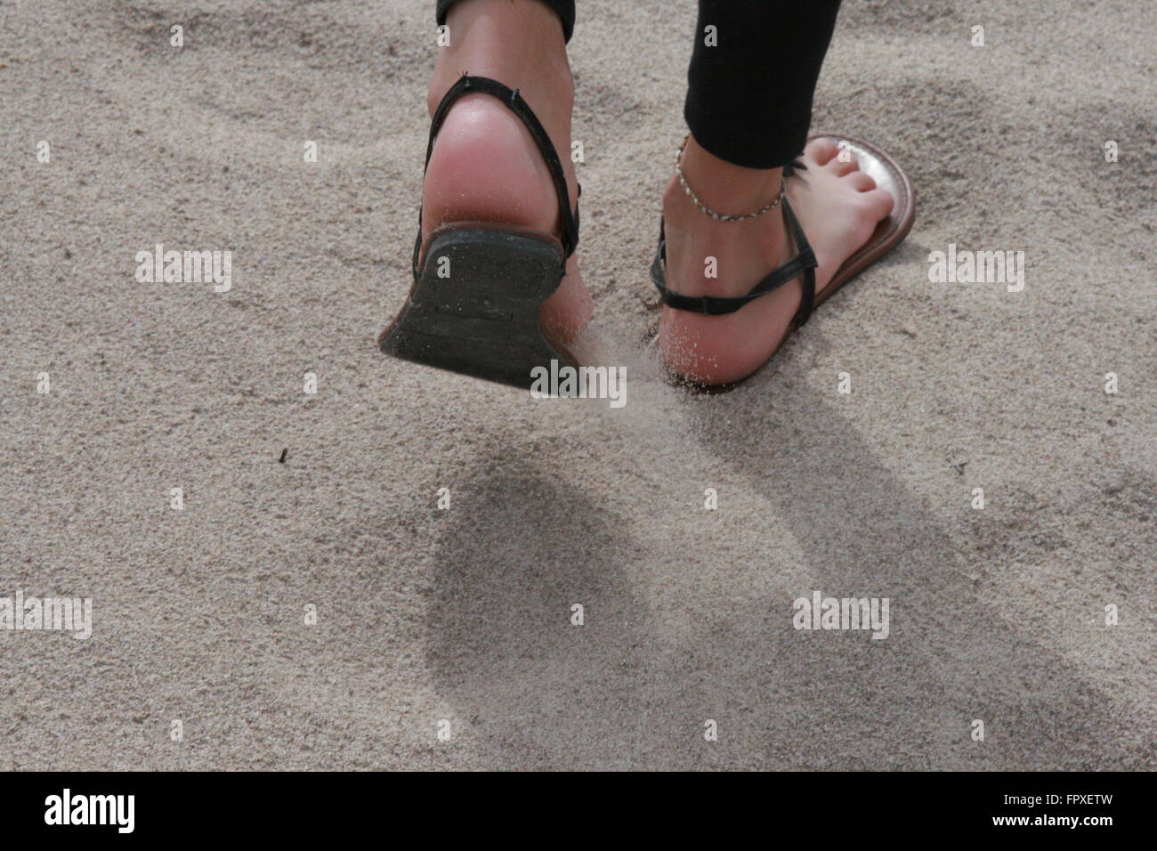 Walking beach hot feet sandals hi-res stock photography and images - Alamy