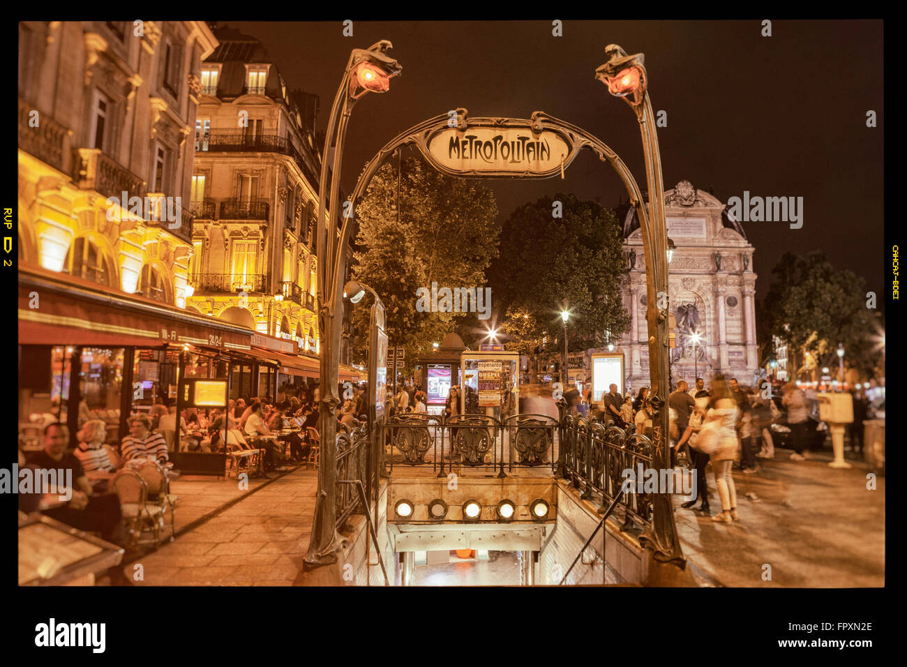 PARIS - JULY 12, 2014: Art Noveau Metropolitan sign in Place St. Michel. Saint Michel station located in the center of Paris. Stock Photo