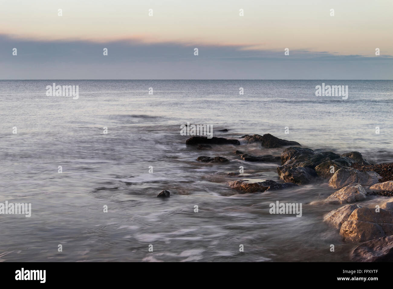 Sunrise over ocean and rocks hi-res stock photography and images - Alamy