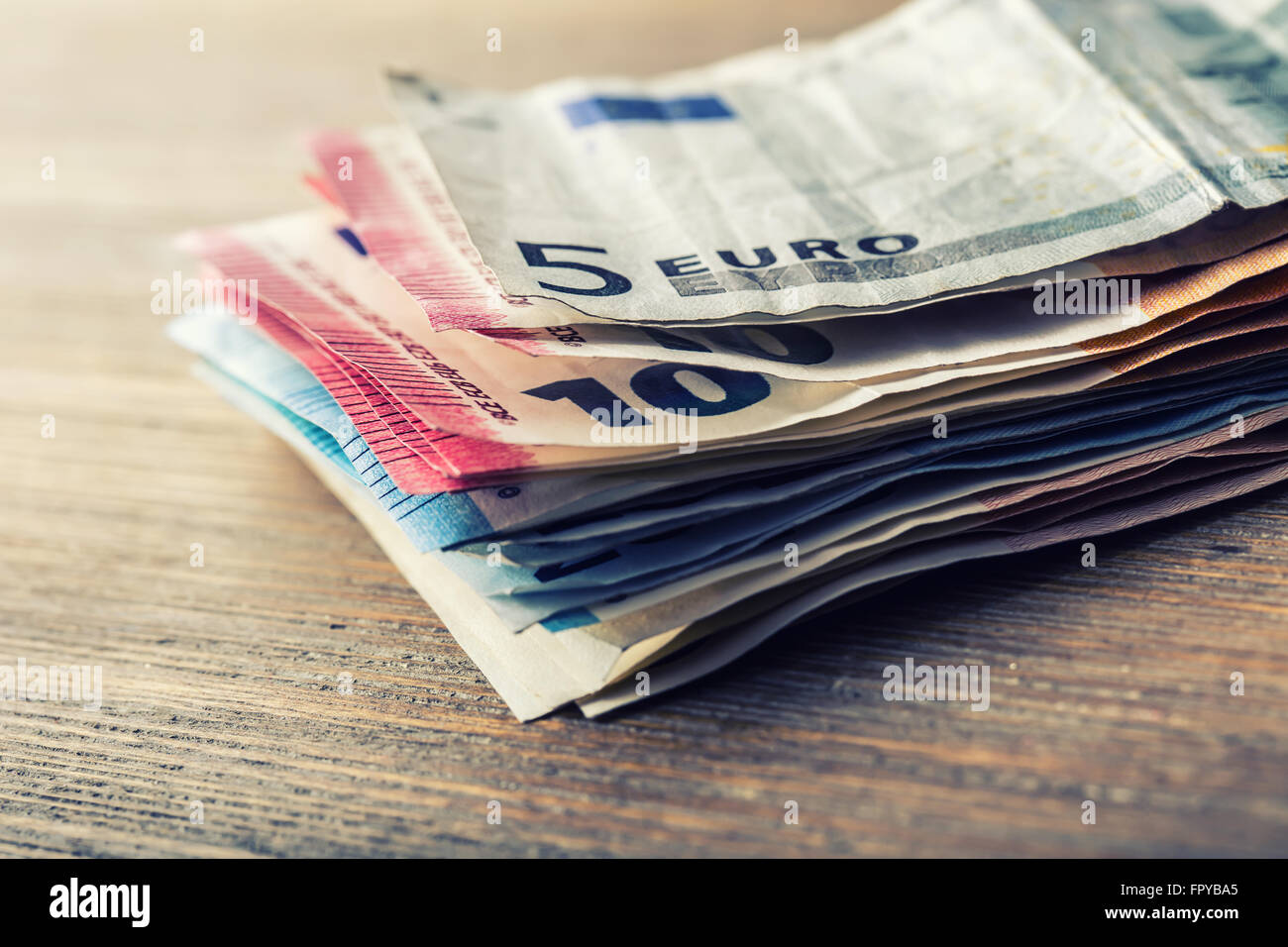 Several hundred euro banknotes stacked by value. Euro money concept. Euro banknotes. Euro currency. Stock Photo