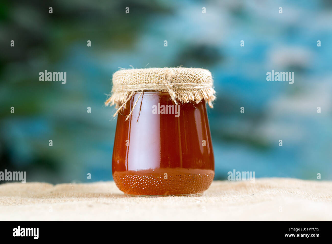 Glass honey jar Stock Photo - Alamy