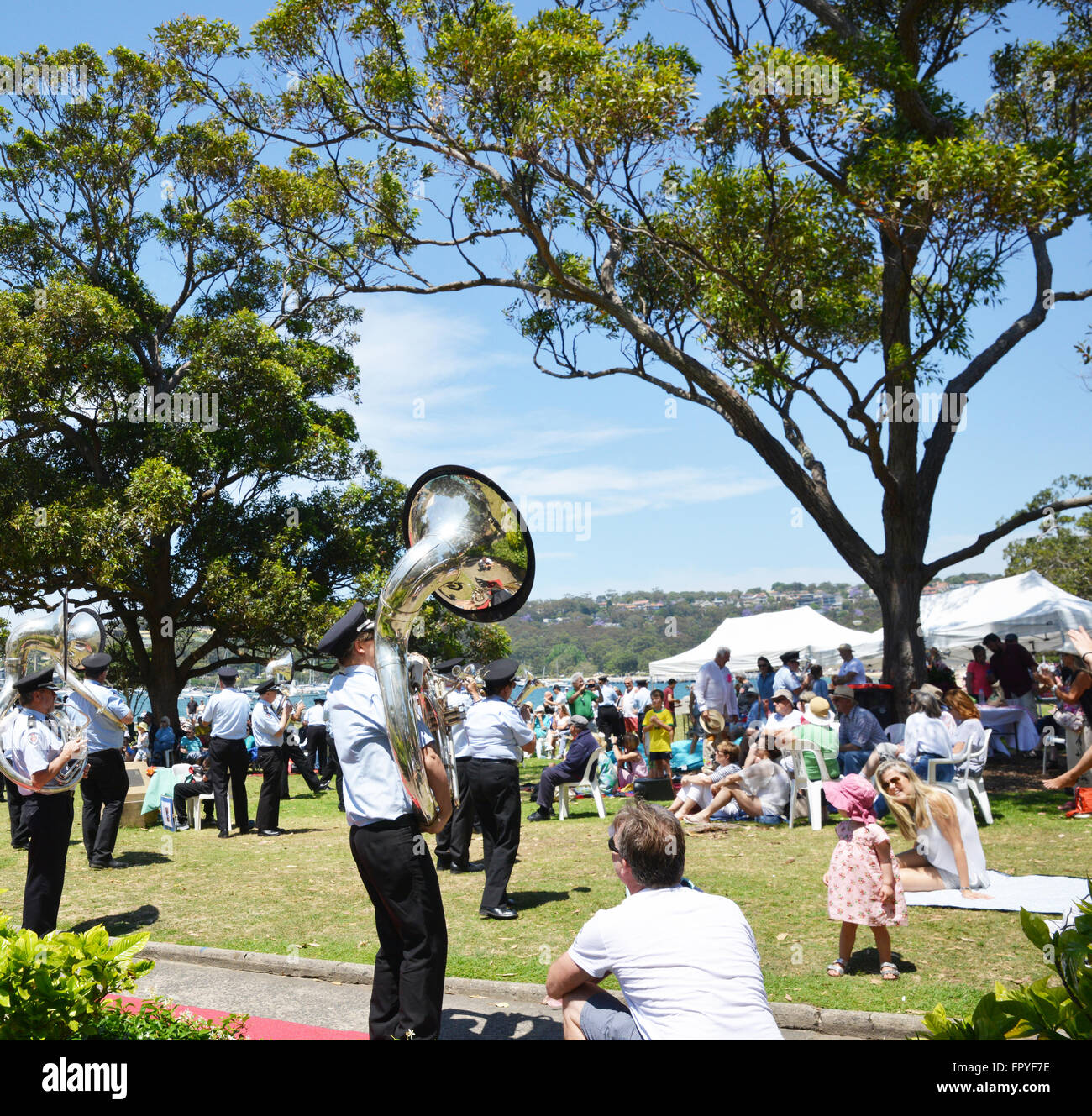 NSW Fire & Rescue Band on Sydney Beach, Sydney Australia. People enjoying a day out on the beach with the band playing. Stock Photo