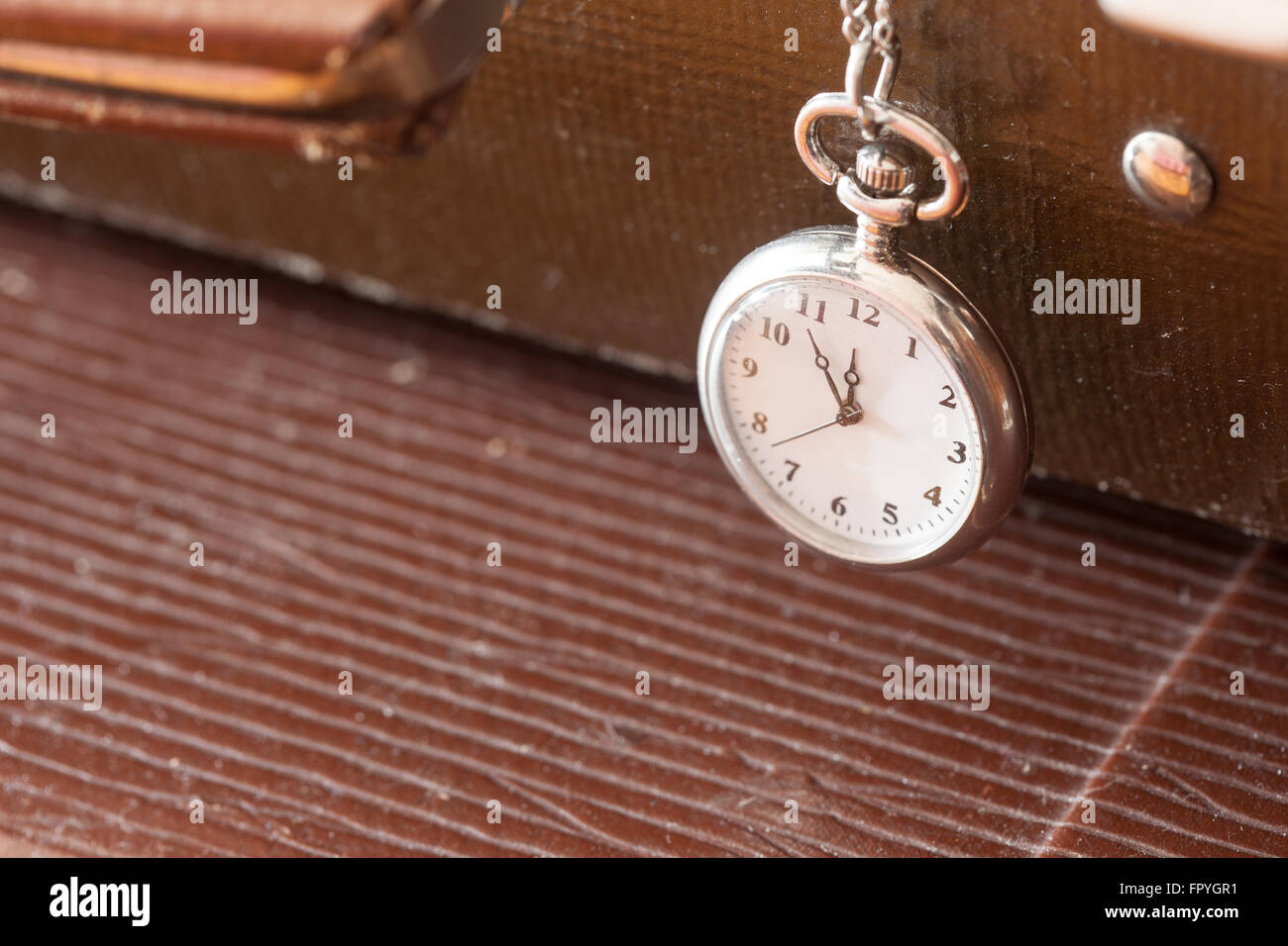 vintage pocket watch closeup on a leather suitcase Stock Photo Alamy