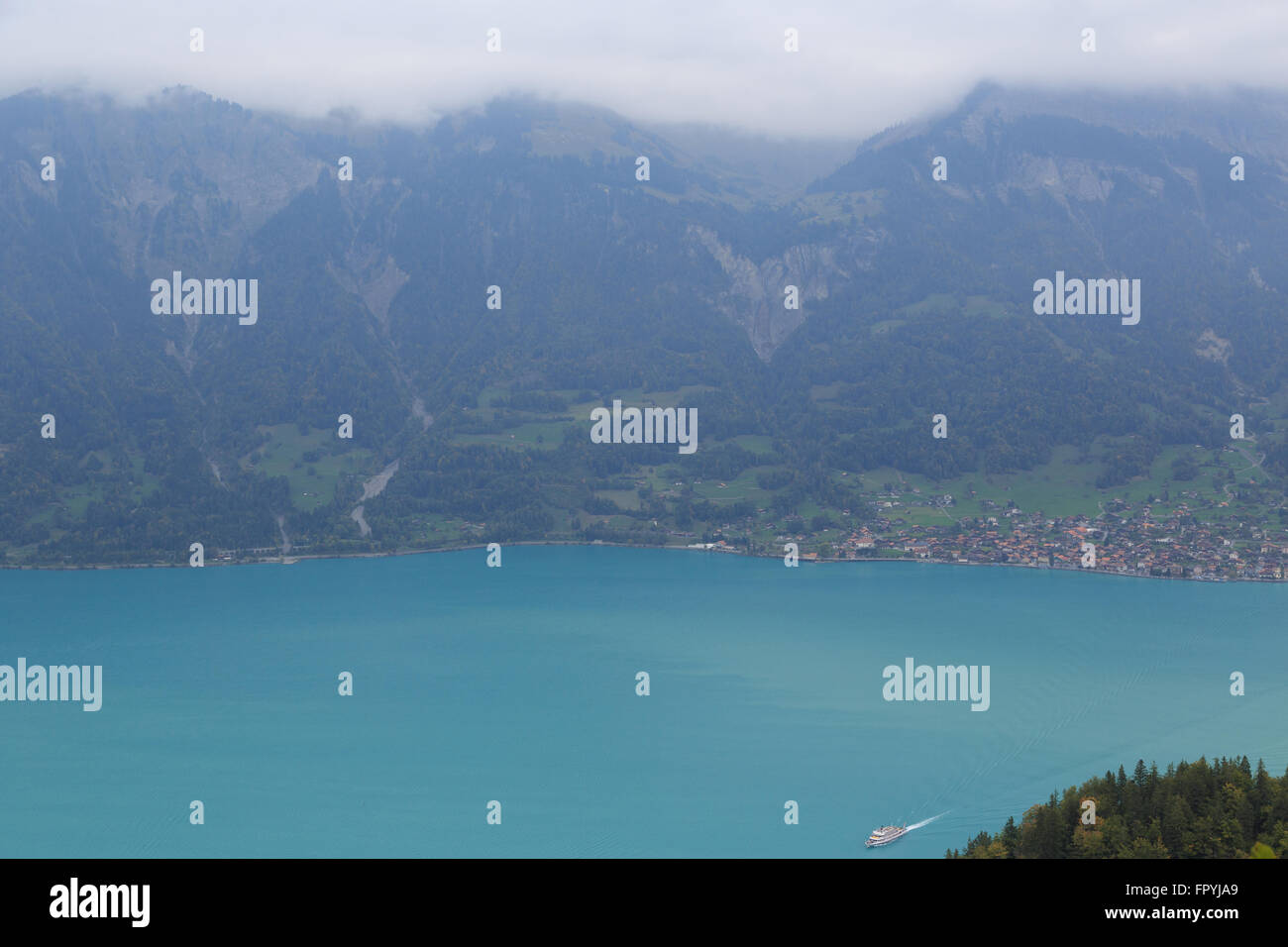 A landscape photograph of a passenger ferry on Lake Brienz in Switzerland. Stock Photo