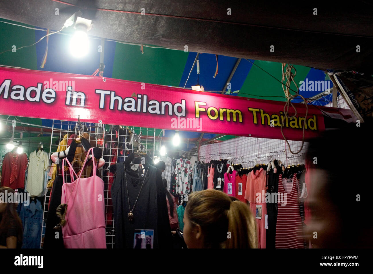 People Are Shopping For Clothes Made In Thailand At A Street Fair In 