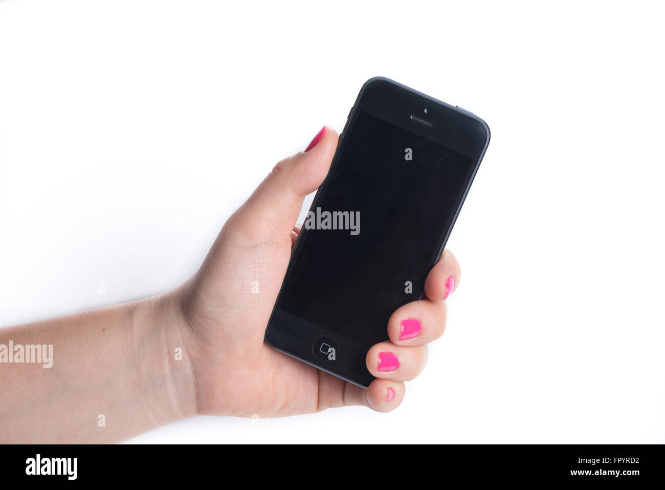 Paris, France, October 31, 2015: Woman holding in the hand an  black iPhone 6 isolated on a white background Stock Photo