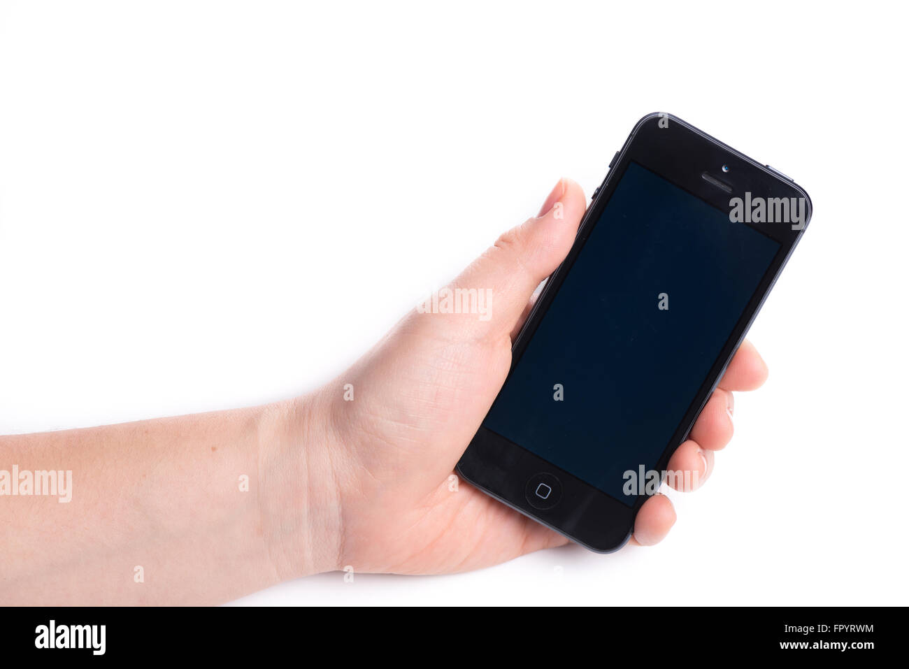 Paris, France, October 31, 2015: Woman holding in the hand an  black iPhone 6 isolated on a white background Stock Photo