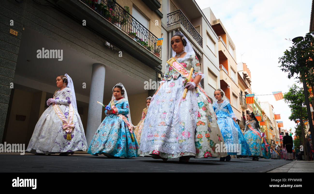 Young girls in traditional Spanish Dress in the Fallas Procession in Gandia Spain Stock Photo