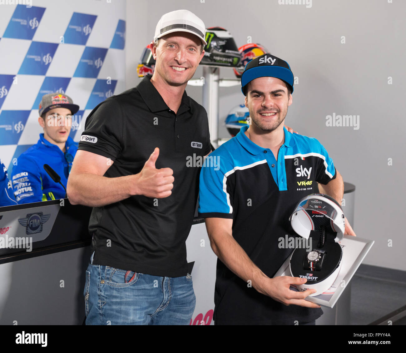 Losail International Circuit, Qatar.  19th March 2016.  Colin Edwards presents the Tisot Pole Position award to Moto3 rider Romano Fenati during the Tissot Pole awards press conference Credit:  Tom Morgan/Alamy Live News Stock Photo