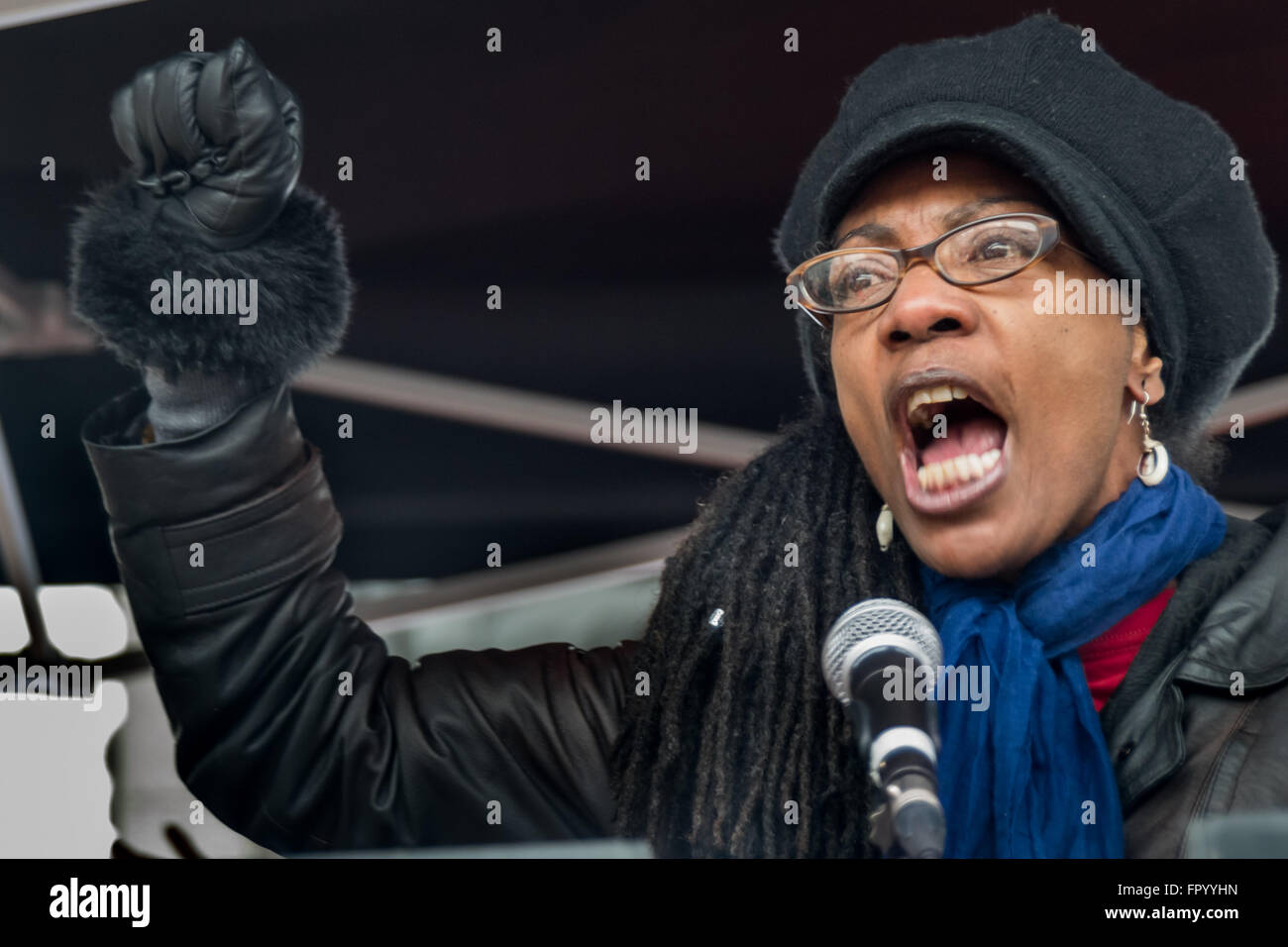 London, UK. Saturday 19th March 2016.  Marcia Rigg, who has lead the long fight to get justice for her brother Sean Rigg, killed by police at Brixton Police Station in 2008, and for other police victims with mental health problems, speaks at the Trafalgar Square 'Refugees Welcome Here' rally organised by Stand Up to Racism against racism, Islamophobia, anti-Semitism and fascism. Peter Marshall/Alamy Live News Stock Photo